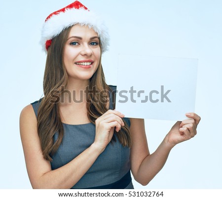 smiling santa girl holding white blank sign board. business dress. isolated portrait.