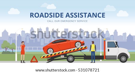 Roadside assistance and car insurance concept: broken car on a tow truck and woman calling emergency services Royalty-Free Stock Photo #531078721