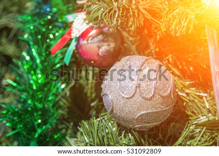 silver balls Christmas  light  and tree in the background.design effect focus happy holiday party colorful  glow texture white wall paper silhouette sun suny