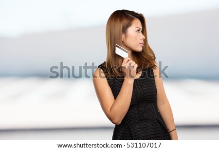 chinese woman holding a credit card
