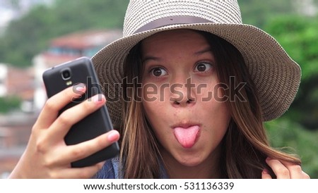 Adorable Teen Girl Making Selfies And Funny Faces