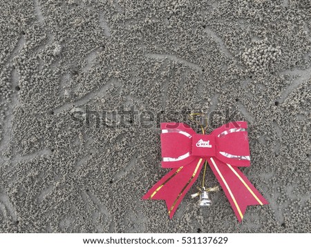 Ribbon for christmas decoration on the sandy beach.