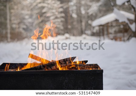 the fire in the grill Royalty-Free Stock Photo #531147409