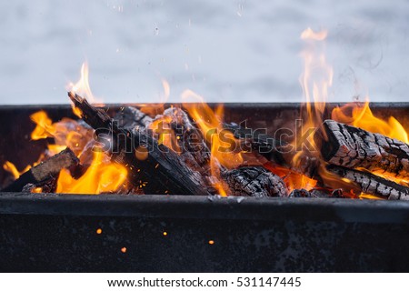 the fire in the grill Royalty-Free Stock Photo #531147445