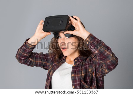 young girl testing virtual reality glasses