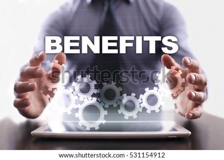 Businessman is using tablet pc and selecting benefits.