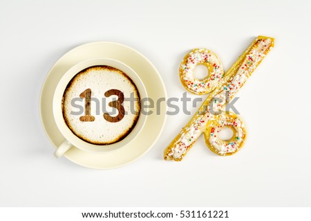 The number 13 on the milk foam of coffee and the percent sign from the pastry