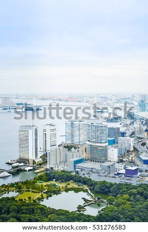 Asia Business concept for real estate - vertical modern cityscape building bird eye aerial view of Odaiba bay and rainbow bridge under sunrise and morning blue bright sky in Tokyo, Japan
