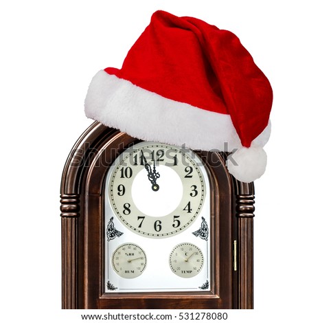 Grandfather clock and cap of Santa Claus, isolated on white background