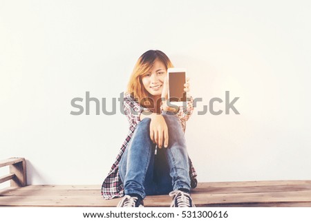 Close-up of a woman typing on mobile phone isolated on white background,Woman's hand holding smartphone.