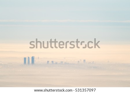 Artistic cityscape of Madrid city with fog in the morning. Artistic picture