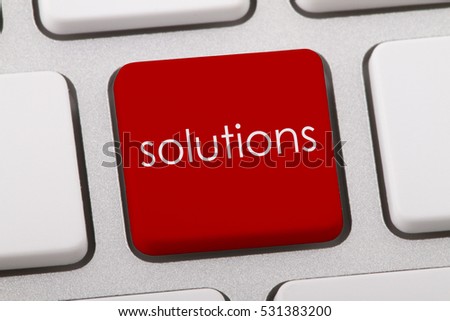Solutions word written on computer keyboard.