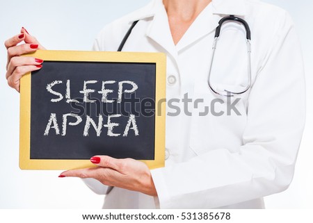 Sleep Apnea Chalkboard Sign Held By Female Doctor.