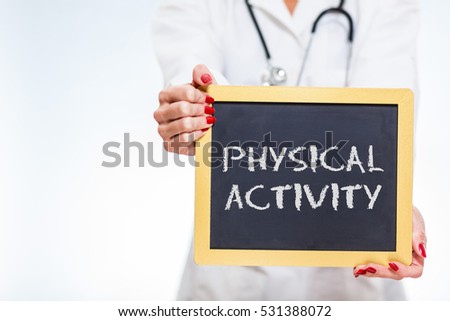 Physical Activity Chalkboard Sign Held By Female Doctor With Copy Space.