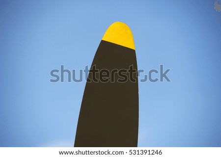 Propeller blade against blue sky