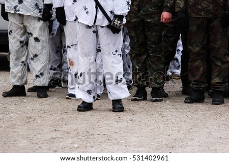 row of young men on military exercises of historical replay military action