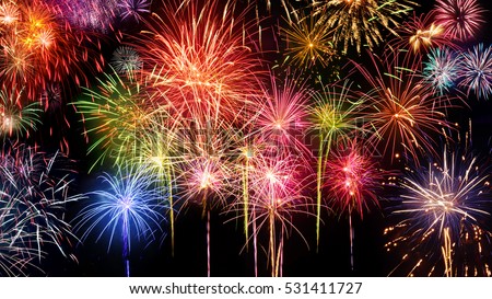 Lively multi-colored fireworks on black background, ideal for New Year, party or any celebration event Royalty-Free Stock Photo #531411727