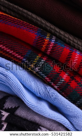 stack of warm and cozy wool sweaters