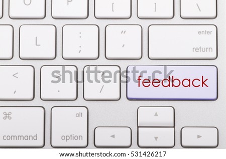 Feedback word written on computer keyboard.