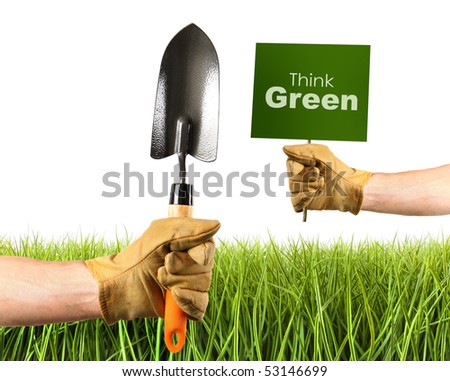 Hands holding garden trowel and sign on white background