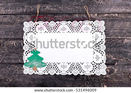 Christmas, pure white napkin, placed on a wooden, vintage look background