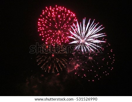Fireworks light up the sky with dazzling display celebration  New years eve congratulations event stock, photo, photograph, picture, image