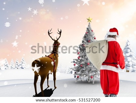 Santa claus walking on snowy landscape with reindeer against digitally generated background