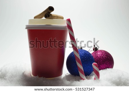 Cup of coffee with cinnamon, candy and Christmas decorations