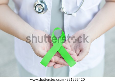Doctor in white uniform hold lime green ribbon awareness in hand for Kabuki Syndrome,Lyme Disease,Lymphoma,Muscular Dystrophy,Non-Hodgkin's Lymphoma,Sandhoff Disease,Spinal Cord Injuries (SCI), mental