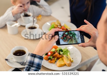 Close-up Man's hands Taking Picture Of Food With Mobile smart Phone