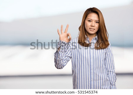 chinese woman doing okay gesture