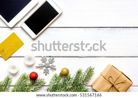 smartphone, tablet, shopping for new year online wooden table