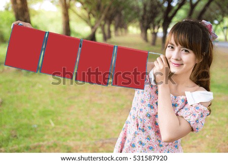 smile of cute woman hand holding blank paper sign. copy space