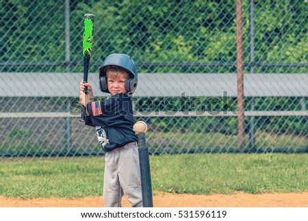 Child Playing Baseball Royalty-Free Stock Photo #531596119