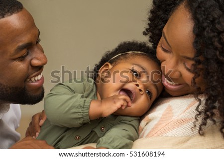 Happy family with their baby.