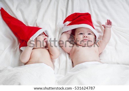 Two cute newborn Santa