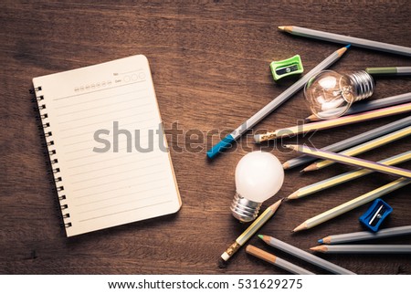 Writing equipment with light bulbs as symbol of idea or inspiration