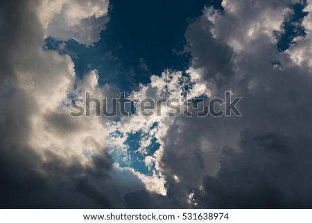 Cloudy sky blue background. Sky in daylight with dark clouds, can be use for background.