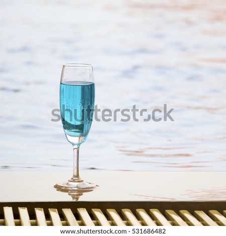 Blue cocktail is at the pool.