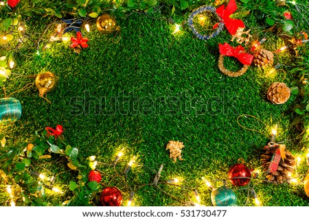 Christmas day on green grass and copy space . Morning sunshine day and good day.Happy time together in winter season.Textures background top view.