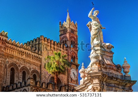 Sculpture in front of Palermo Cathedral church against blue sky, Sicily, Italy Royalty-Free Stock Photo #531737131