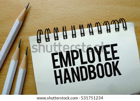 Employee Handbook text written on a notebook with pencils Royalty-Free Stock Photo #531751234