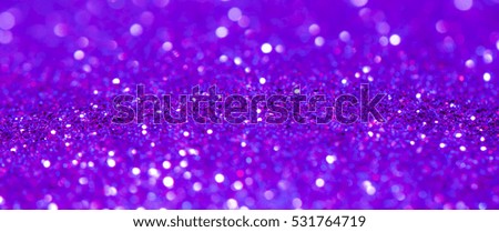 defocused lights background. purple glitter