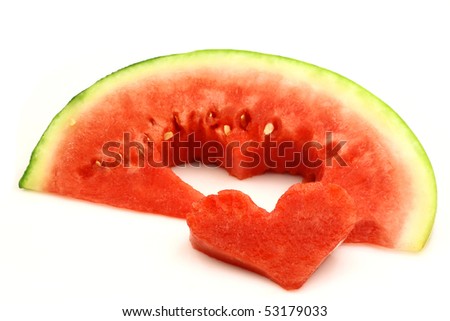 fresh and ripe watermelon piece with a heart cut out  on a white background