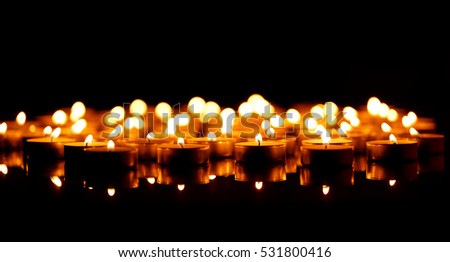 Many burning candles with shallow depth of field