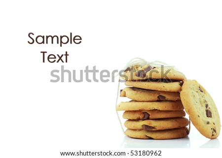Chocolate chip cookies tied into a stack against a white background with reflection.