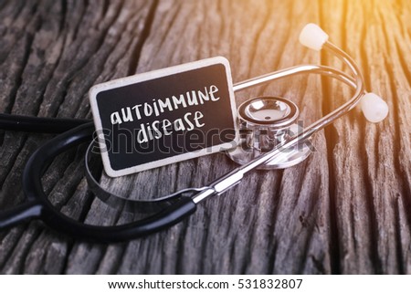 Stethoscope on wood with autoimmune disease word as medical concept Royalty-Free Stock Photo #531832807