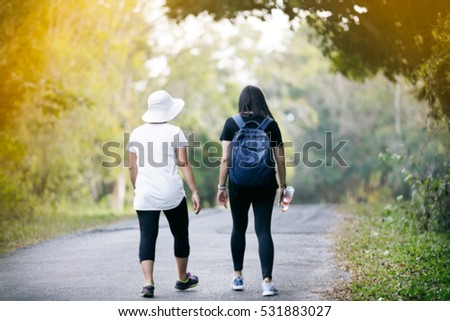 Blurry of Camping Friendship Walking Backpacker and  Forest Adventure Travel Remote Relax Concept