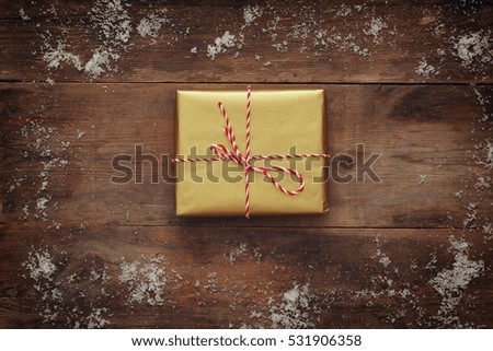 Flat lay image of handmade gift boxes over wooden background

