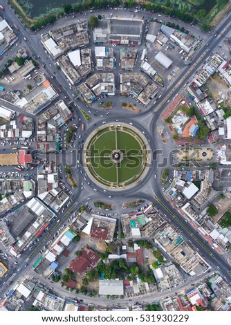 Aerial view Road roundabout with car lots in the city in Thailand.street large beautiful downtown .cityscape.